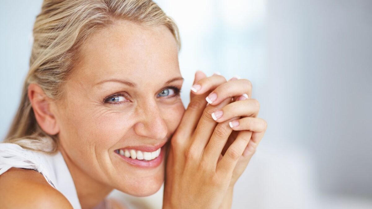 beautiful middle aged woman smiling on camera