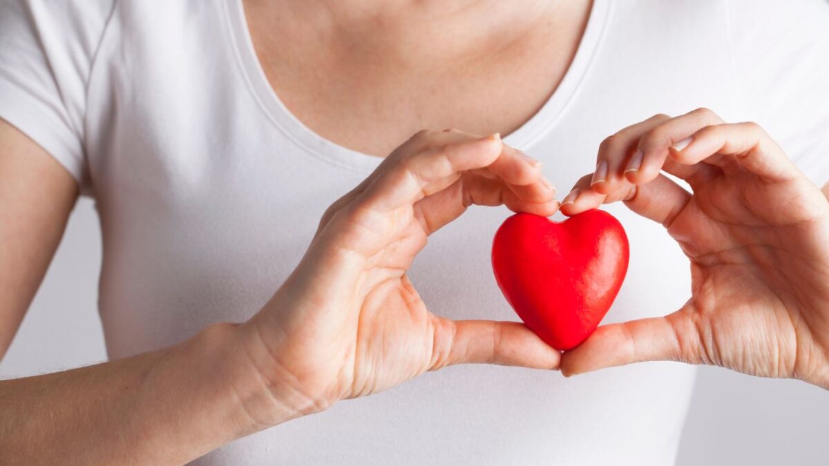 woman holding a heart shape