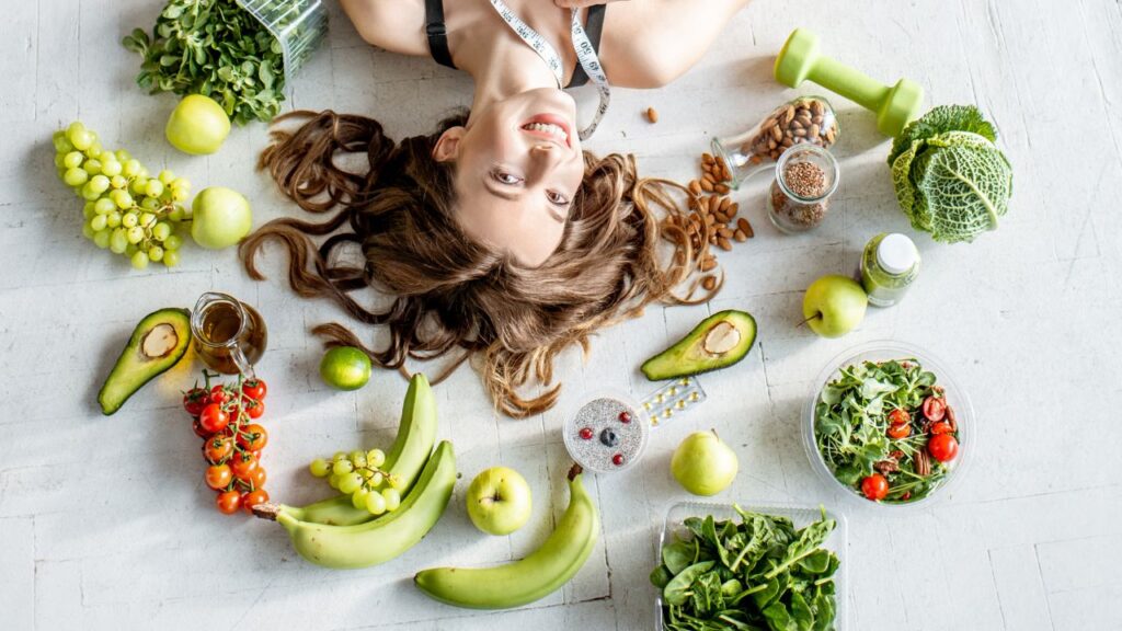 Fit Woman Surrounded by Healthy Food