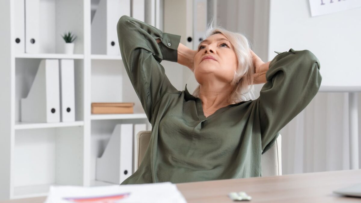 woman behind desk - menopause at the workplace