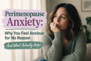 Woman looking anxious by a window with perimenopause anxiety text overlay.